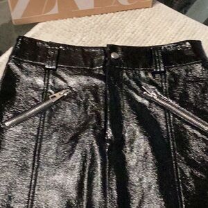 New! Bershka Faux Leather skirt. Waist 28”. Zip front pockets. Patent leather.